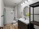 Tastefully designed bathroom with shower, stylish vanity, and modern mirror offers a relaxing retreat at 10057 S Shadow Hill Dr, Lone Tree, CO 80124