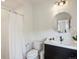 Clean bathroom with modern vanity, decorative mirror, and shower/tub with white tile offers a functional space at 10057 S Shadow Hill Dr, Lone Tree, CO 80124