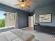 Bedroom with carpet, queen bed, and large window at 10057 S Shadow Hill Dr, Lone Tree, CO 80124