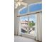 Bright bedroom window with white shutters and curtains offers neighborhood views and plenty of natural light at 10057 S Shadow Hill Dr, Lone Tree, CO 80124