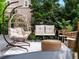 Inviting deck area with cozy hanging chair, bench, and scenic view offering relaxation and outdoor enjoyment at 10057 S Shadow Hill Dr, Lone Tree, CO 80124