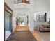 Bright foyer with hardwood floors transitioning into a welcoming living space, perfect for entertaining at 10057 S Shadow Hill Dr, Lone Tree, CO 80124