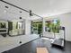 Home gym with clear glass enclosure offering view of the pool and adjacent living area at 10057 S Shadow Hill Dr, Lone Tree, CO 80124