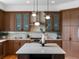 Bright kitchen featuring custom cabinets, modern lighting, a subway tile backsplash, and stainless appliances at 10057 S Shadow Hill Dr, Lone Tree, CO 80124