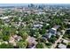 Scenic aerial view featuring the city skyline nestled behind a lush neighborhood at 3512 Wyandot St, Denver, CO 80211
