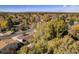 An aerial view of the neighborhood displays colorful fall foliage, residential homes, and tree-lined streets at 3164 S Nucla St, Aurora, CO 80013