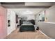 A basement bedroom with carpeted floors, a queen bed, and a decorative tapestry on the wall at 3164 S Nucla St, Aurora, CO 80013