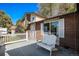 Charming deck area with white wooden bench, perfect for enjoying the outdoors at 3164 S Nucla St, Aurora, CO 80013