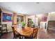 Dining room featuring a wooden table, hardwood floors and lots of light at 3164 S Nucla St, Aurora, CO 80013