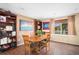 Warm dining room with a wooden table, hardwood floors, and natural light at 3164 S Nucla St, Aurora, CO 80013