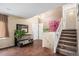 Inviting entryway with staircase and hardwood floors; bright and spacious at 3164 S Nucla St, Aurora, CO 80013