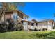 Well-manicured front lawn highlights the charming brick facade, white-trimmed windows, and inviting entrance at 3164 S Nucla St, Aurora, CO 80013