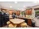 Well-lit kitchen featuring a breakfast bar and modern appliances at 3164 S Nucla St, Aurora, CO 80013