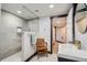 Modern bathroom featuring glass enclosed shower, wood accents and modern sink at 11932 Coal Creek Heights Dr, Golden, CO 80403