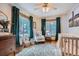 Cozy Bedroom with a large windows, natural lighting, and a comfortable rocking chair at 11932 Coal Creek Heights Dr, Golden, CO 80403