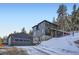 Exterior view of the home with a detached garage at 11932 Coal Creek Heights Dr, Golden, CO 80403