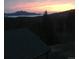 Mountain view from the property in the evening at 11932 Coal Creek Heights Dr, Golden, CO 80403