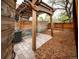 Backyard patio featuring a wooden pergola, privacy fence and outdoor seating area at 2714 N Federal Blvd, Denver, CO 80211