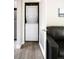 Laundry closet with stacked washer and dryer units at 2714 N Federal Blvd, Denver, CO 80211