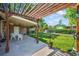 Inviting backyard patio with pergola, outdoor seating, and a lush lawn at 2069 E 116Th Ave, Northglenn, CO 80233