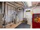 Unfinished basement area featuring a water heater, utility sink, and open ceiling at 2069 E 116Th Ave, Northglenn, CO 80233
