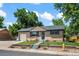 Single-story home with brick facade, attached garage, and manicured front yard at 2069 E 116Th Ave, Northglenn, CO 80233