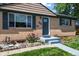 Close up of single-story home showing landscaped front yard and brick facade at 2069 E 116Th Ave, Northglenn, CO 80233