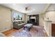 Inviting living room with hardwood floors, large windows, comfortable seating, and neutral walls at 2069 E 116Th Ave, Northglenn, CO 80233