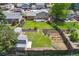 Aerial view of the spacious backyard, featuring a lawn, garden, shed, deck and privacy fence at 11021 Otis St, Westminster, CO 80020
