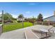 Relaxing backyard deck features outdoor furniture overlooking a landscaped lawn with lush green grass at 11021 Otis St, Westminster, CO 80020