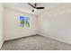 Bright bedroom with plush carpet, a large window, and ample space at 11021 Otis St, Westminster, CO 80020