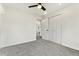 Well-lit bedroom with neutral carpet, a ceiling fan, and a spacious closet at 11021 Otis St, Westminster, CO 80020