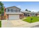 Charming two-story home with a well-manicured front yard and a two-car garage in a suburban setting at 11021 Otis St, Westminster, CO 80020