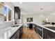 Bright kitchen showcasing white marble countertops, stainless steel appliances, and stylish tile backsplash at 11021 Otis St, Westminster, CO 80020