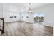 Bright dining room with hardwood floors and access to a deck at 2060 Chambers Rd, Brighton, CO 80601