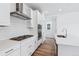 Modern kitchen featuring white cabinets, stainless steel appliances, and a spacious island at 2060 Chambers Rd, Brighton, CO 80601