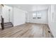 Spacious living room featuring hardwood floors and lots of natural light at 2060 Chambers Rd, Brighton, CO 80601