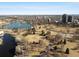 Scenic aerial view of a lush park with lake and city skyline in the background at 2635 N Clayton St, Denver, CO 80205