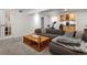 Relaxing basement featuring a comfortable seating area, exercise bike and a wet bar at 2635 N Clayton St, Denver, CO 80205