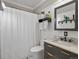 Stylish bathroom with a vanity, updated fixtures and a shower with tub combination at 2635 N Clayton St, Denver, CO 80205