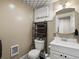 Cozy bathroom with stylish vanity and mirror complemented by a patterned ceiling at 2635 N Clayton St, Denver, CO 80205