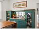 Elegant dining room showcasing a vintage built-in cabinet with glass doors, drawers, and plenty of storage at 2635 N Clayton St, Denver, CO 80205