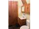 Small bathroom with wooden vanity, mirror and slate tile flooring at 274 Lincoln Dr, Idaho Springs, CO 80452