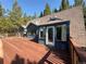 Large deck with views of the lush pine trees at 274 Lincoln Dr, Idaho Springs, CO 80452
