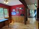 Inviting dining area with wood paneling, bright natural light, rustic beams, and accents for a cozy feel at 274 Lincoln Dr, Idaho Springs, CO 80452