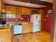 Charming kitchen featuring wood cabinetry, red walls, and rustic wood flooring for a warm and inviting atmosphere at 274 Lincoln Dr, Idaho Springs, CO 80452