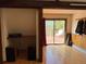 Sun-filled living room boasts hardwood floors and access to a private balcony with outdoor seating at 274 Lincoln Dr, Idaho Springs, CO 80452