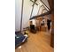 Bright living room with hardwood floors, spiral staircase, and high, beamed ceilings at 274 Lincoln Dr, Idaho Springs, CO 80452