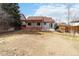 Wide view of a spacious backyard with a wooden pergola and room for outdoor activities at 5402 Sweet Grass Ct, Castle Rock, CO 80109