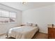 Cozy bedroom with a neutral palette and ample natural light from the window at 5402 Sweet Grass Ct, Castle Rock, CO 80109